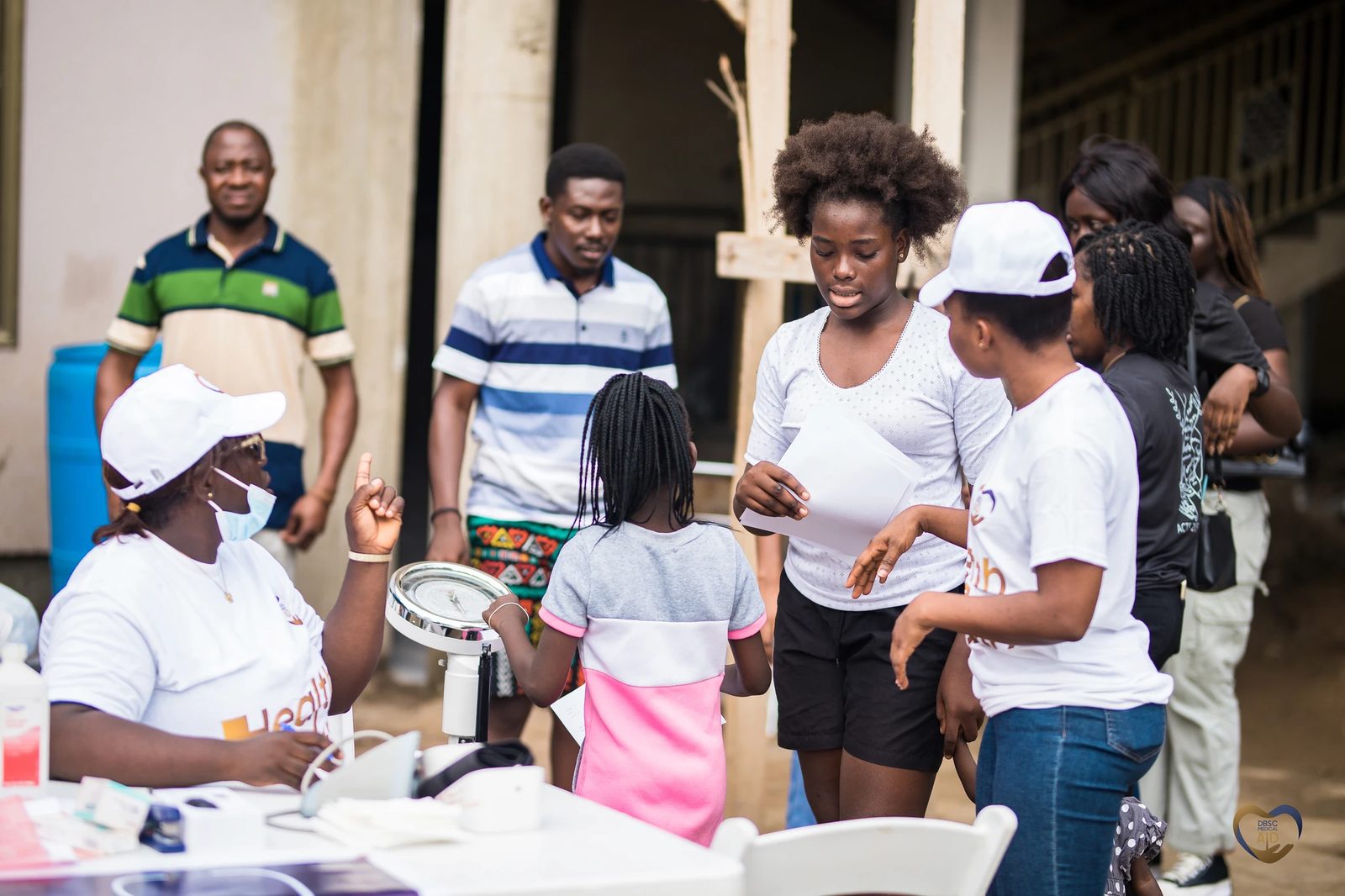 People gathered at a DBSC Medical Aid outreach