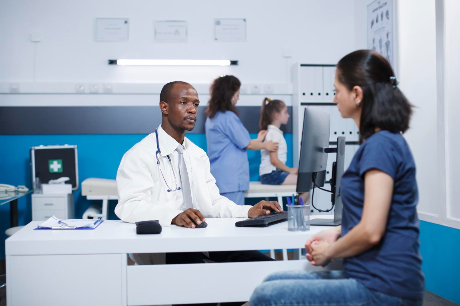 A DBSC doctor in consultation with a patient